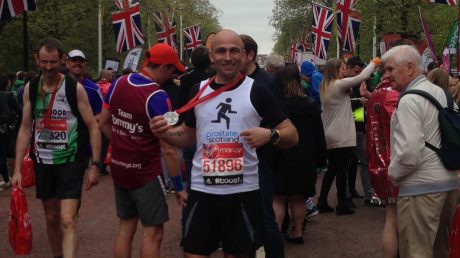 London Marathon finisher holding medal